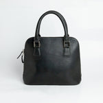 The back of The Executive Handbag in black leather.