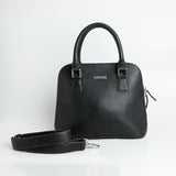 Close view of the black Spanish milled leather and stitching on The Executive Handbag.