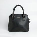 The Executive Handbag in black Spanish milled leather, front view.