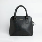 The Executive Handbag in black Spanish milled leather, front view.