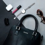 The Executive Handbag in black Spanish milled leather, styled.