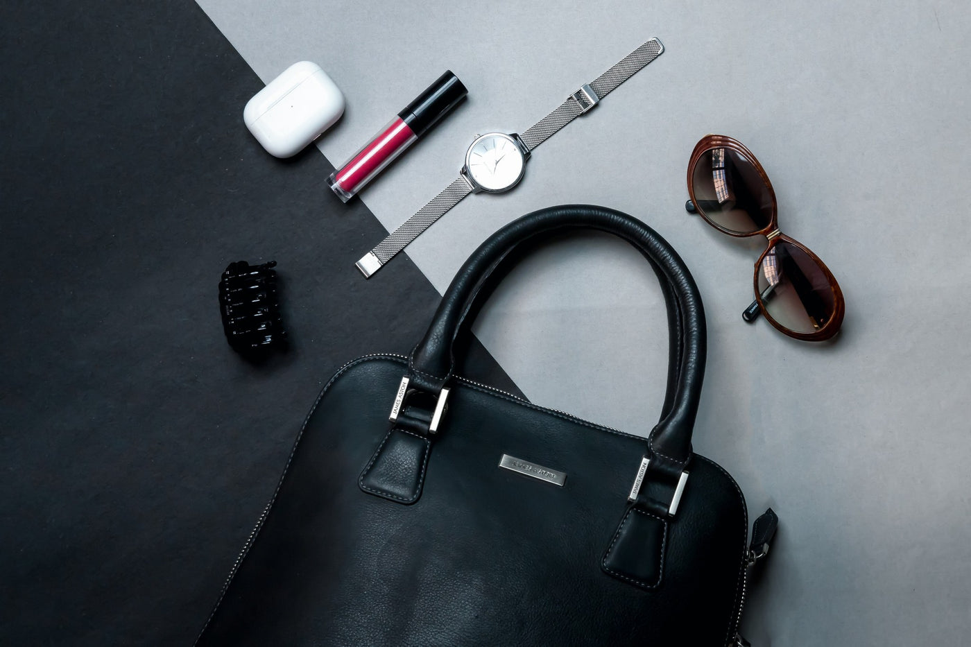 The Executive Handbag in black Spanish full grain milled leather, styled.