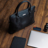 The Executive Laptop Bag in black, carried for the day.