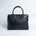 The Executive Laptop Bag in black Spanish milled leather, front view.