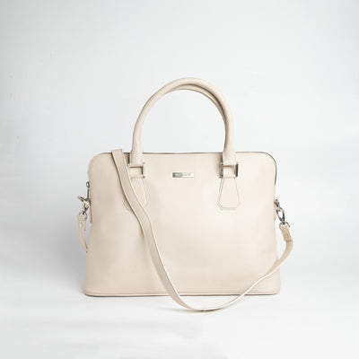 Close view of the off-white Spanish full grain leather and stitching on The Executive Laptop Bag.