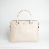 The Executive Laptop Bag in off-white Spanish milled leather, front view.