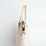 Side profile of The Executive Laptop Bag in off-white leather.