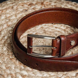 Detail of the Australian Nut Italian Full Grain Vachetta leather and feather-edged stitching of the Federico belt