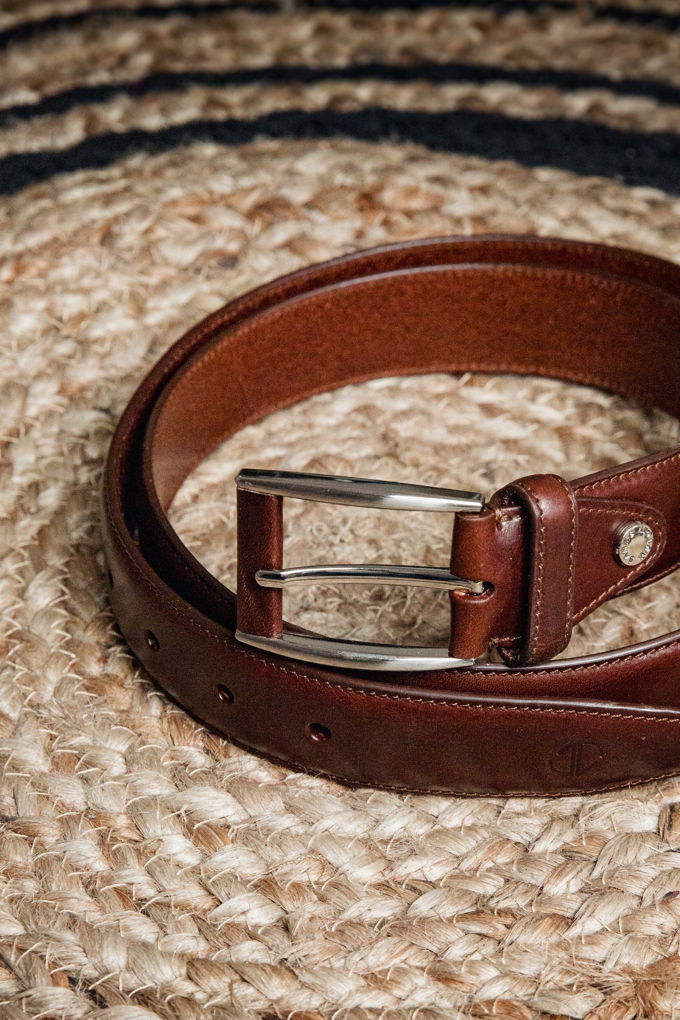 Detail of the Australian Nut Italian Full Grain Vachetta leather and feather-edged stitching of the Federico belt