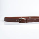 The Federico belt in Australian Nut Italian Full Grain Vachetta leather shown at full length, with brushed nickel buckle