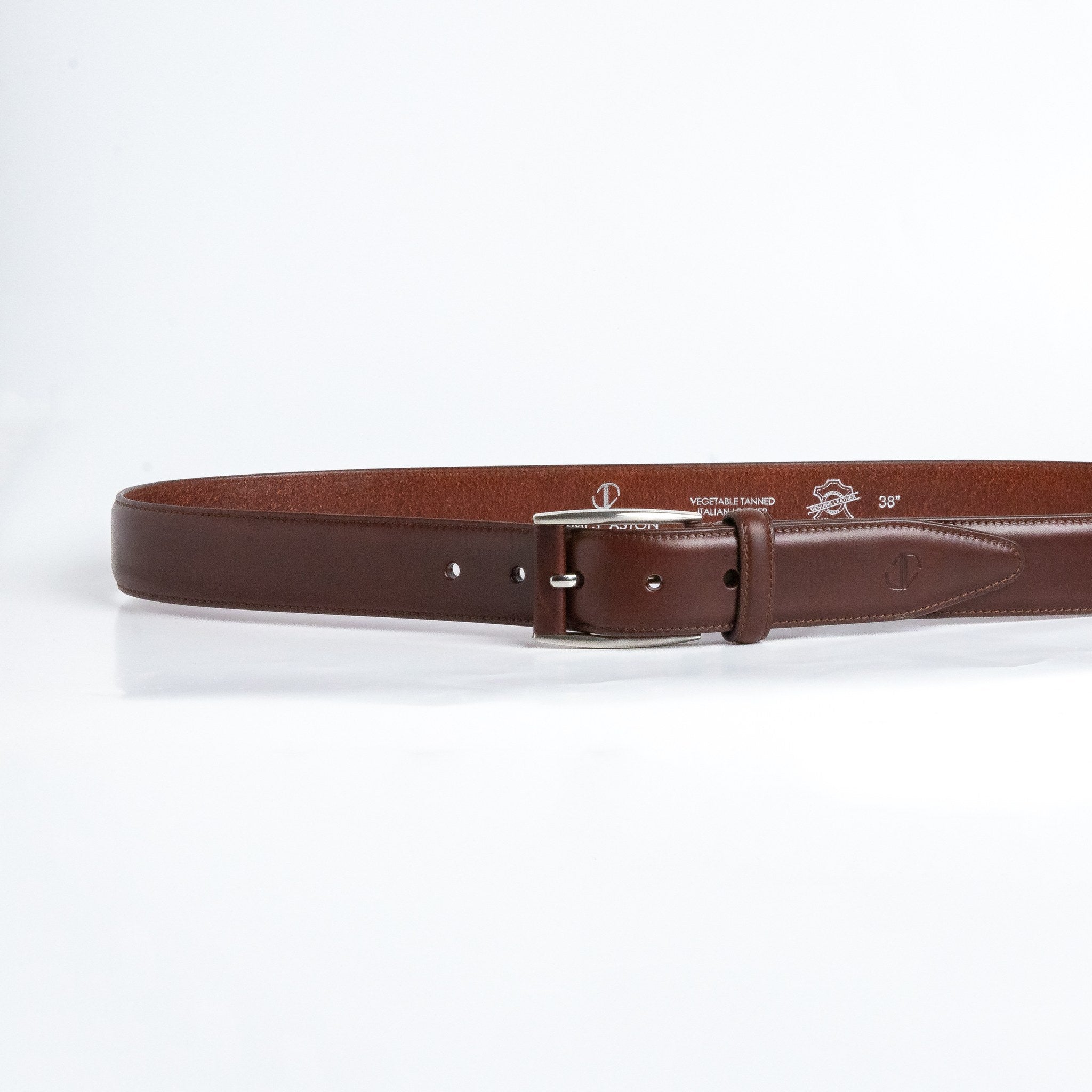 The Federico belt in Australian Nut Italian Full Grain Vachetta leather shown at full length, with brushed nickel buckle