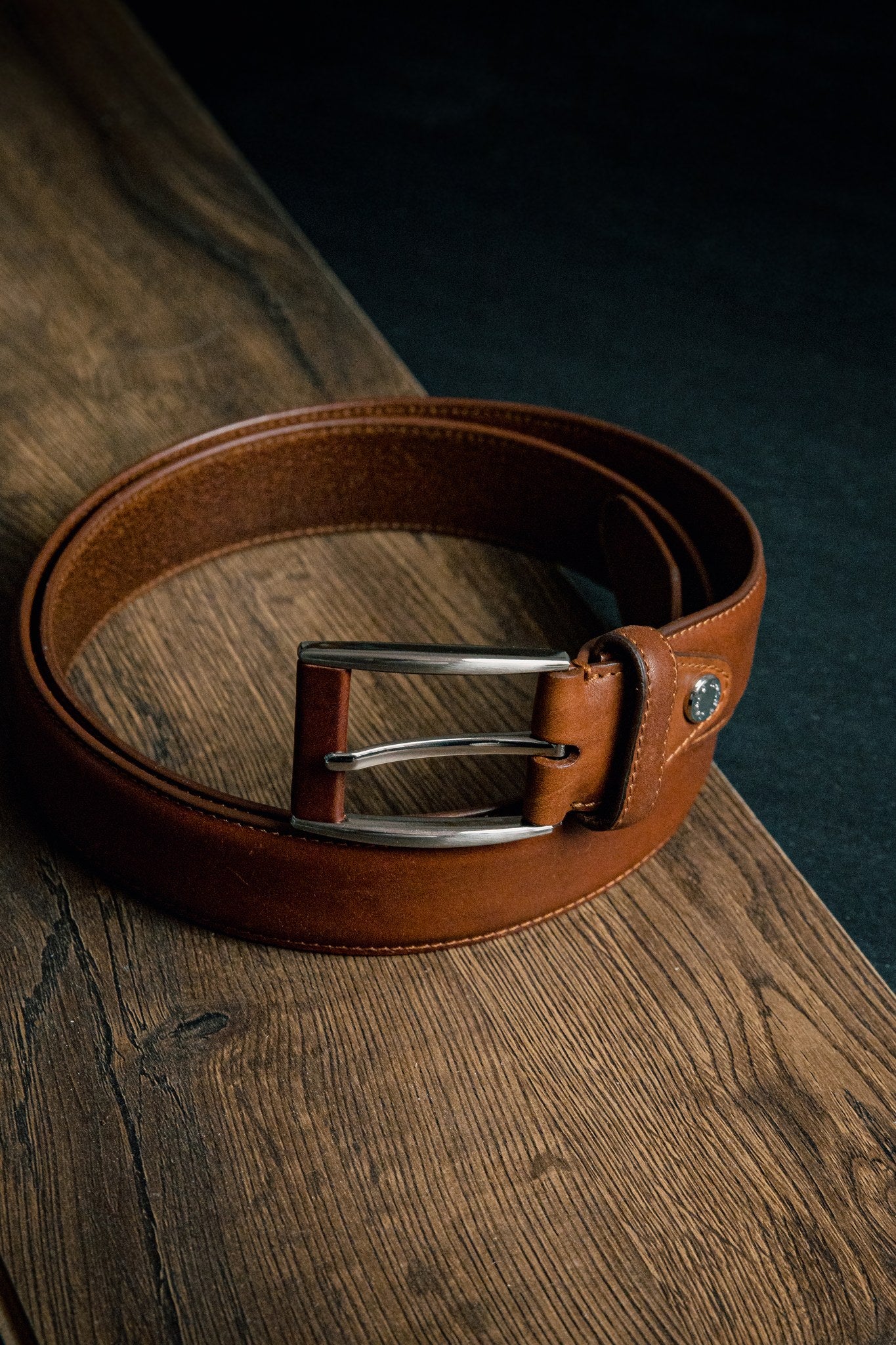 The Federico belt in cognac Italian Full Grain Vachetta leather, composed and at rest