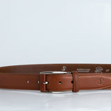 The Federico belt in cognac Italian Full Grain Vachetta leather shown at full length, with brushed nickel buckle