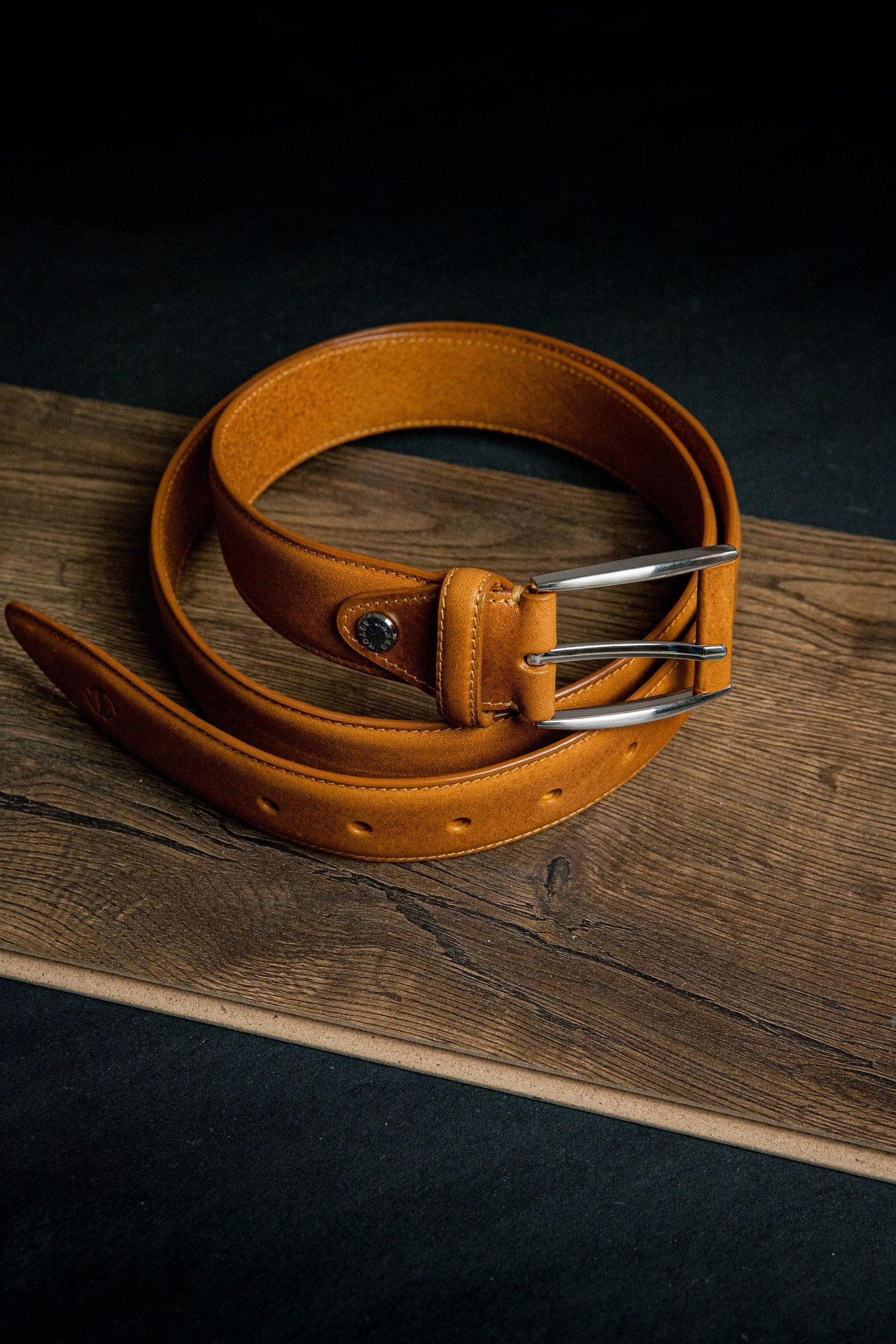 The Federico belt in tan Italian Full Grain Vachetta leather, composed and at rest