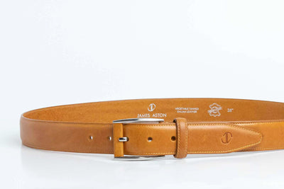 The Federico belt in tan Italian Full Grain Vachetta leather shown at full length, with brushed nickel buckle