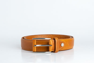Close view of the brushed nickel buckle and solid brass screw on the Federico belt in tan