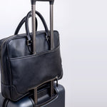 The back of The Mentor, with the zip panel and the sleeve that passes over a wheeled case handle for travel.