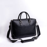 Stitching and full grain leather trim detail on The Mentor black laptop bag.