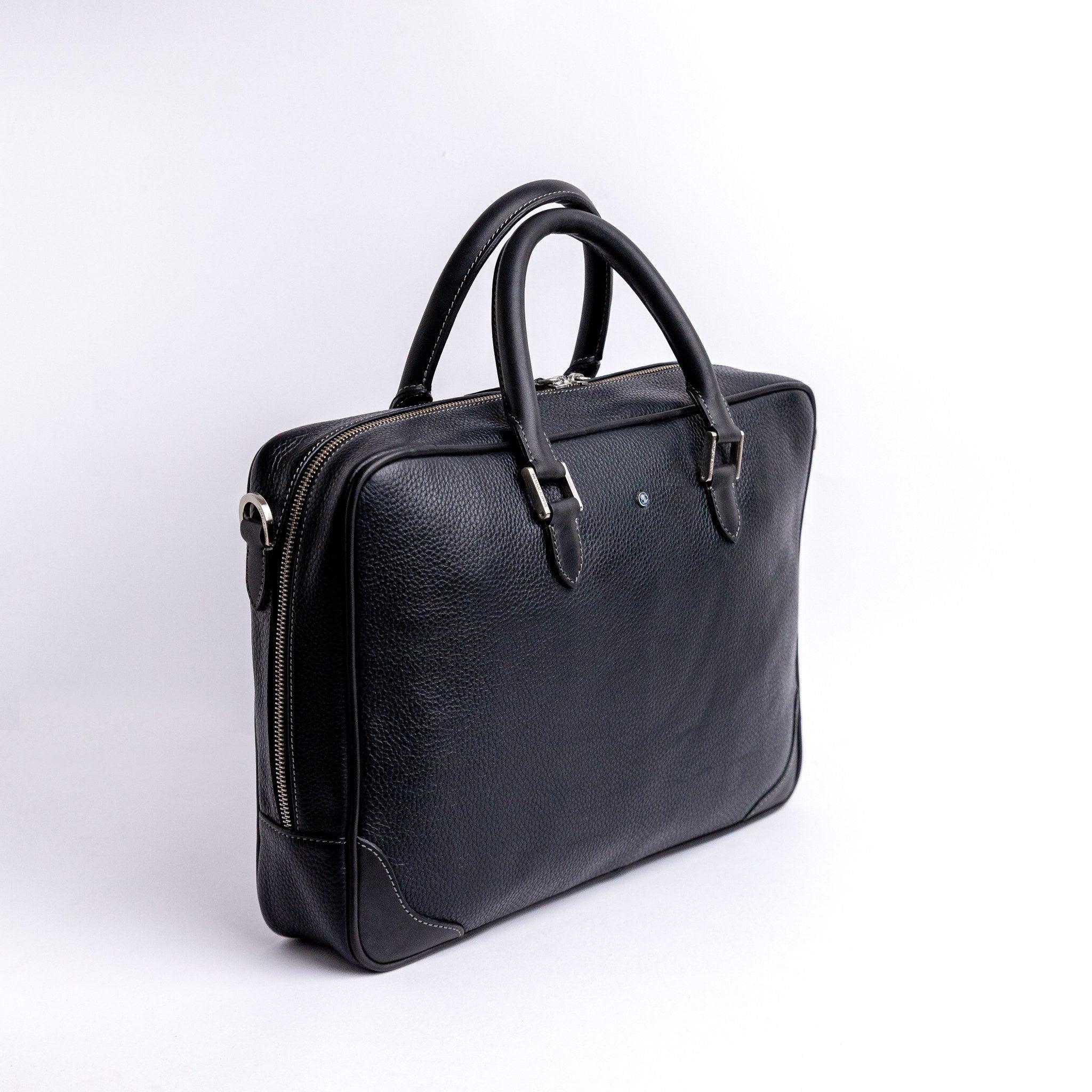 The Mentor black leather laptop bag, full form showing the rolled handles and structure.