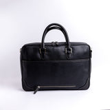 Close view of the Spanish full grain leather grain on The Mentor, in black.