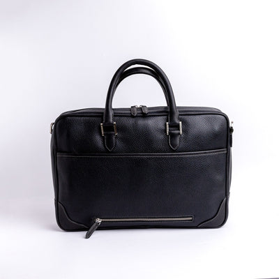 Close view of the Spanish full grain pebbled leather grain on The Mentor, in black.