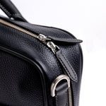 Brushed nickel zip and metalware on The Mentor black leather laptop bag.