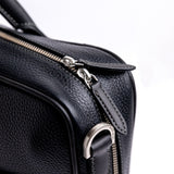 Brushed nickel zip and metalware on The Mentor black leather laptop bag.