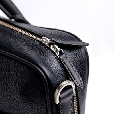 Brushed nickel zip and metalware on The Mentor black leather laptop bag.