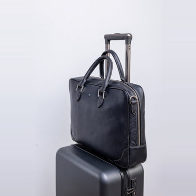 Side profile of The Mentor black leather laptop bag.