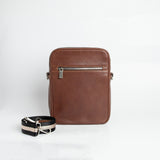 The back of The Minimal Sling cognac leather sling bag.