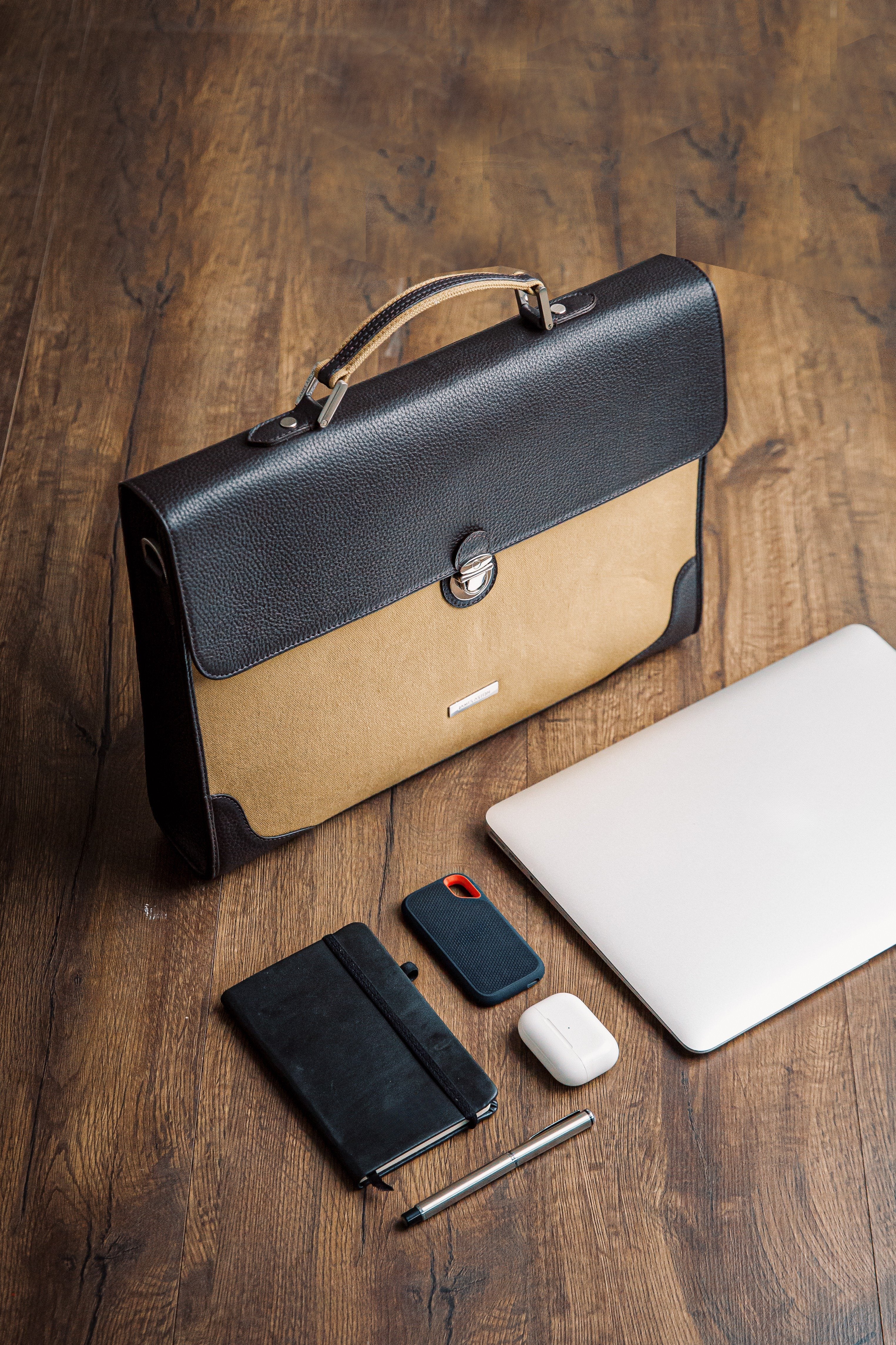 The Motivator canvas briefcase in khaki beige, packed for the working day.