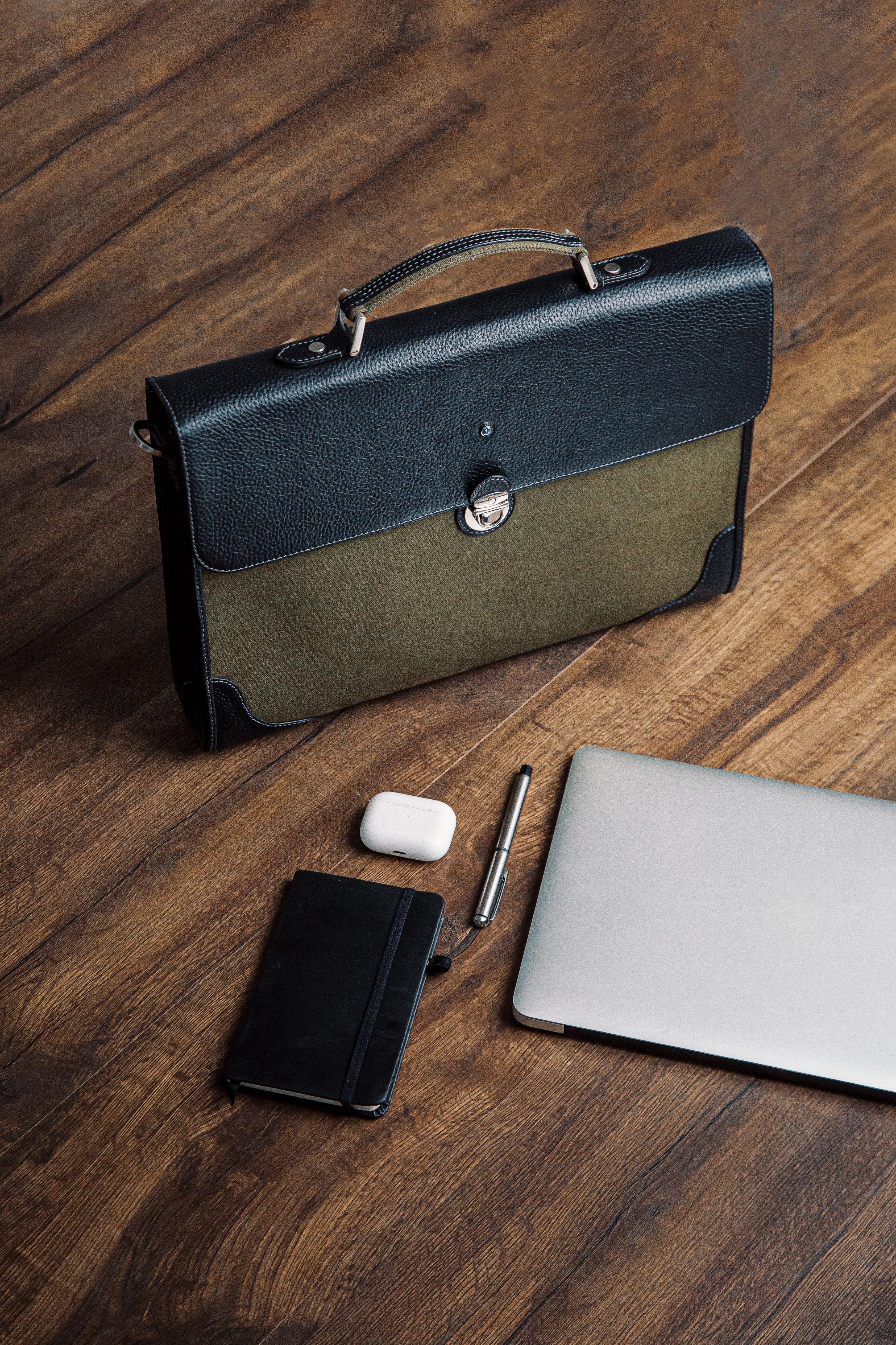 The Motivator canvas briefcase in khaki green, packed for the working day.