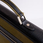 Brushed nickel metalware and YKK zip on The Motivator canvas briefcase.