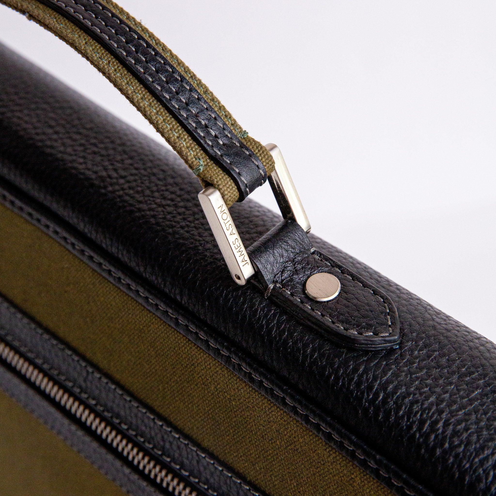 Brushed nickel metalware and YKK zip on The Motivator canvas briefcase.