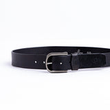 The Pedro belt in black milled leather shown at full length, with silver finish buckle