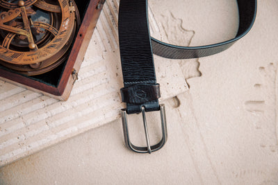 Close view of the silver finish buckle and hand-sewn buckle points on the Pedro belt in black
