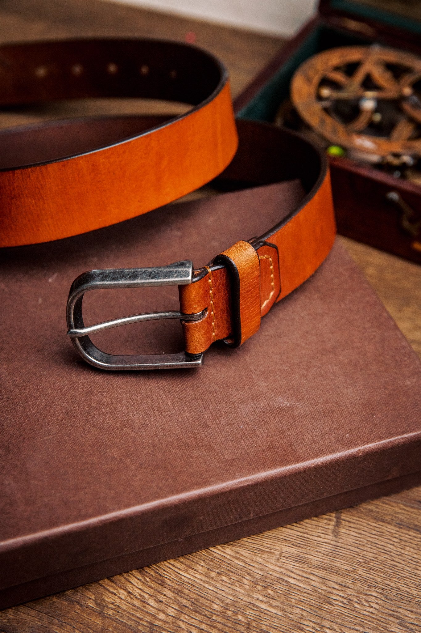 The Pedro belt in tan milled leather, composed and at rest