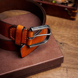 Close view of the silver finish buckle and hand-sewn buckle points on the Pedro belt in tan