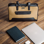 The Risk-Taker khaki beige canvas and Spanish leather briefcase, quietly composed.