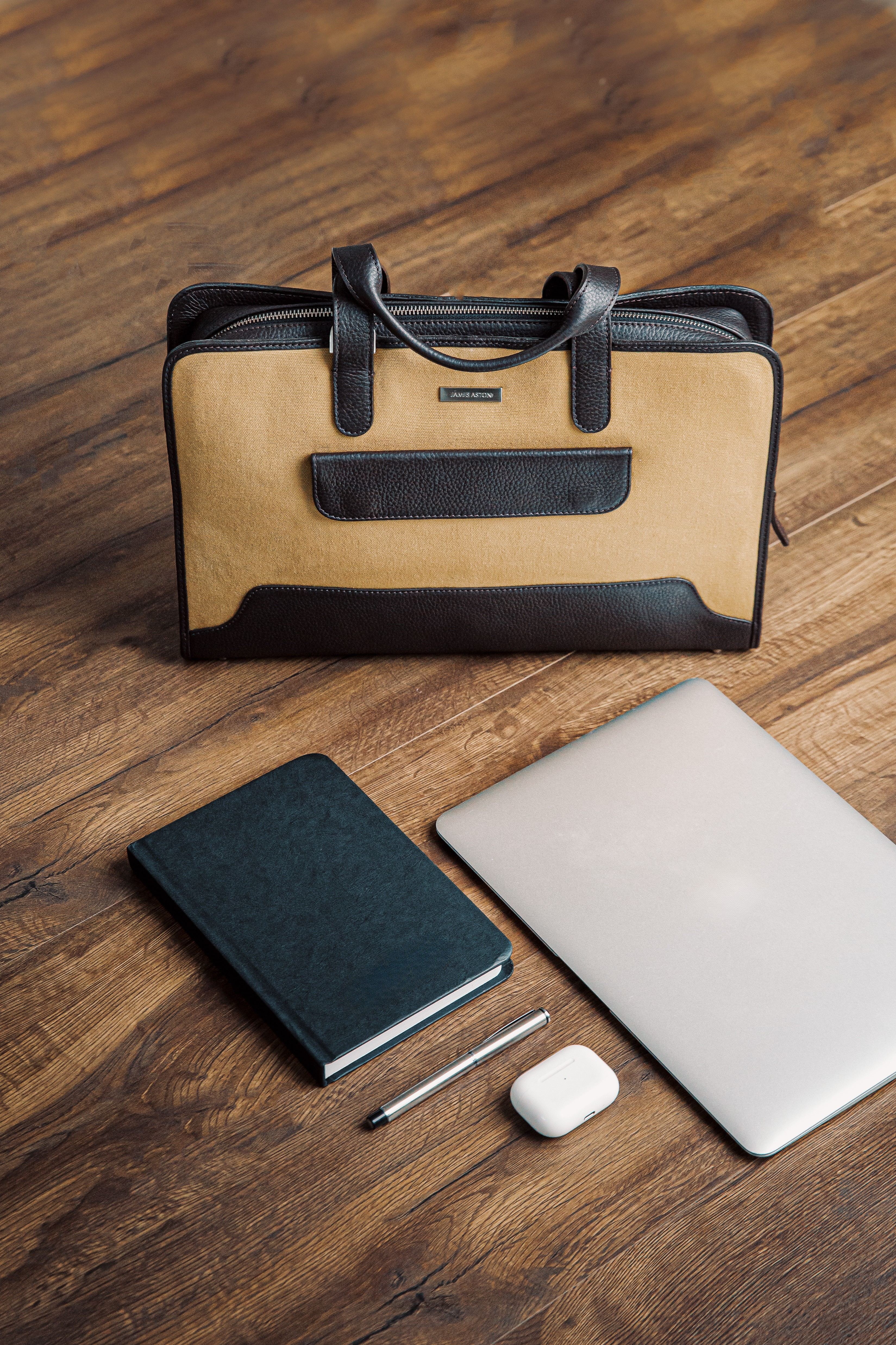 The Risk-Taker khaki beige canvas and Spanish leather briefcase, quietly composed.