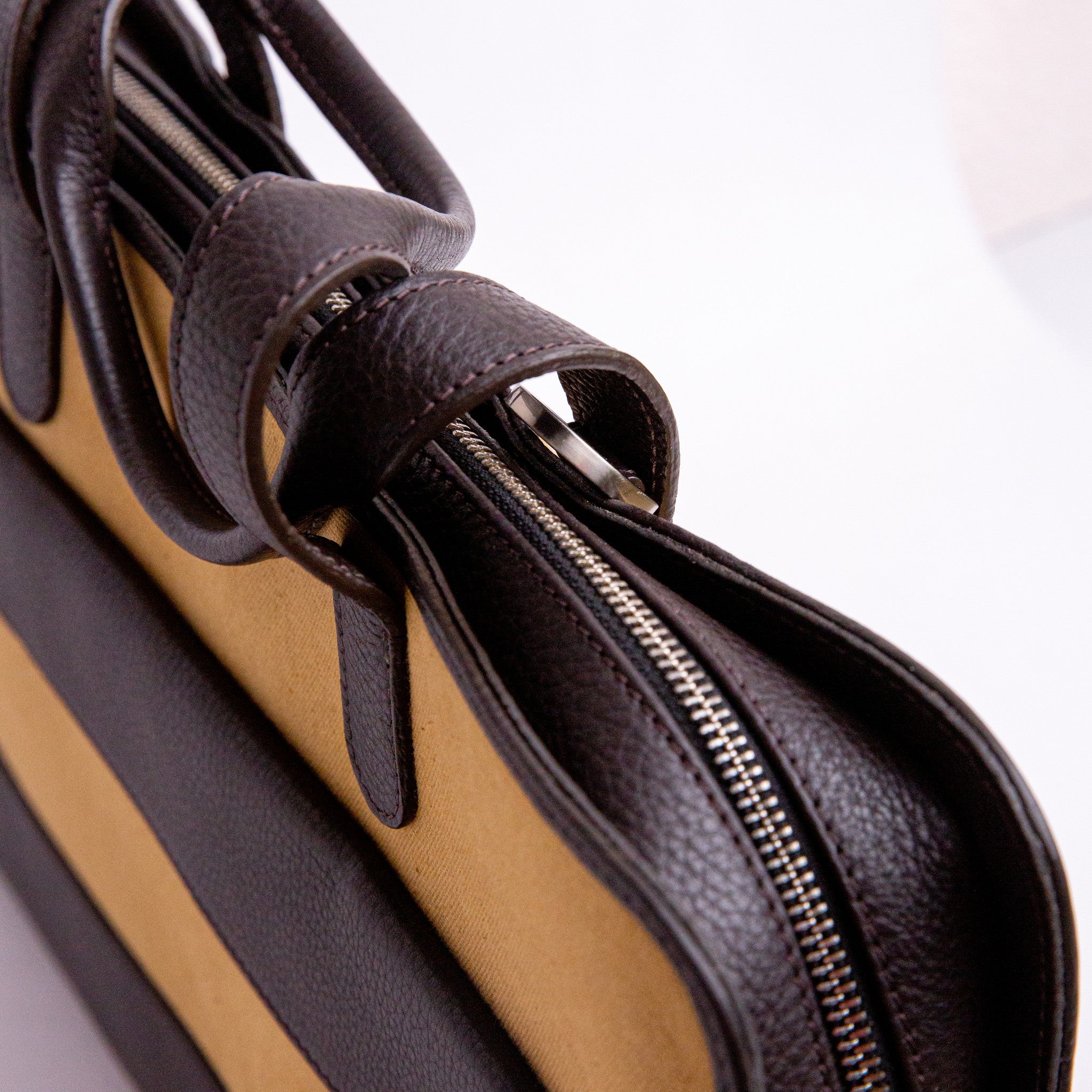 Close view of the cotton canvas and Spanish leather trim on The Risk-Taker, khaki beige.