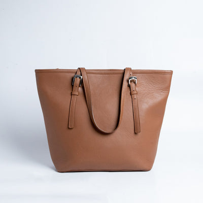 The back of The Wanderer's Tote in cognac leather.