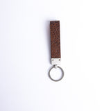 The back of the Vincenzo II key holder in cognac embossed grain leather.