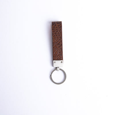 The back of the Vincenzo II key holder in cognac embossed grain leather.