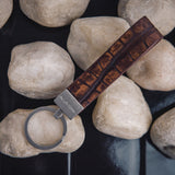 The Vincenzo II key holder in cognac embossed grain leather, composed.
