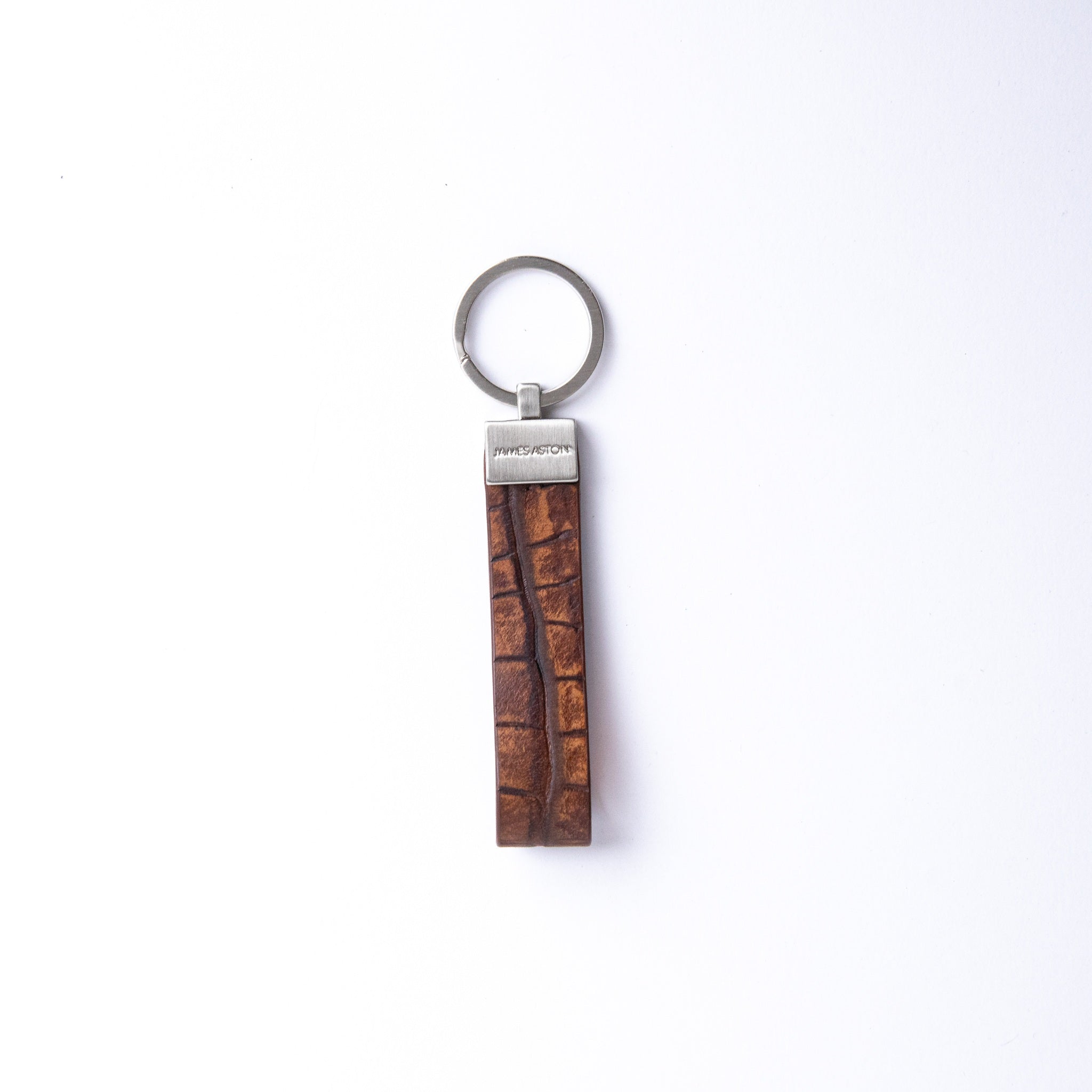 The Vincenzo II key holder in cognac embossed grain leather, with its brushed nickel keyrings.