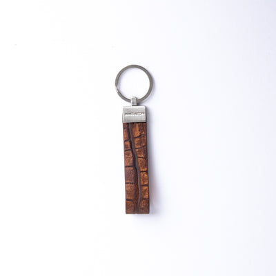 The Vincenzo II key holder in cognac embossed grain leather, with its brushed nickel keyrings.