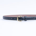 The Vittoria dress belt in black Vachetta leather, full length, with gold buckle.