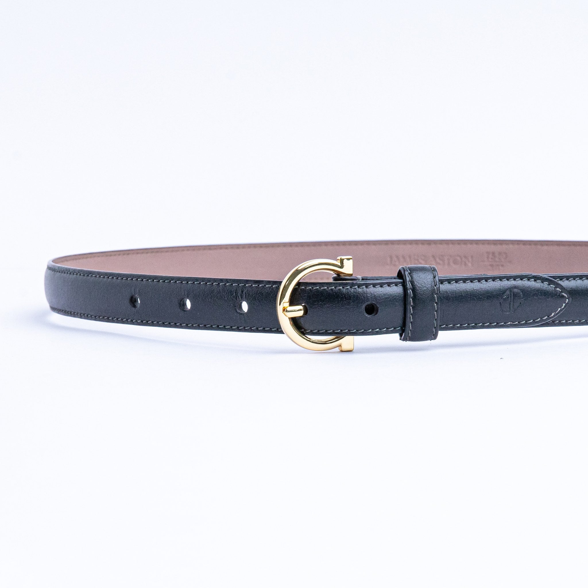 The Vittoria dress belt in black Vachetta leather, full length, with gold buckle.