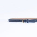 The Viviana dress belt in blue Vachetta leather, full length, with gold buckle.